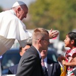 10-6-15Pope Francis Blesses child